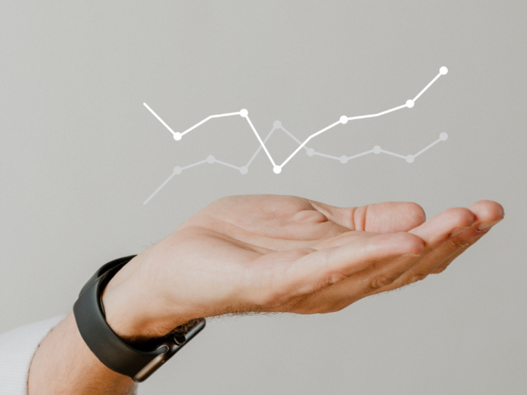 Hand cradling a 3D graph of analytics